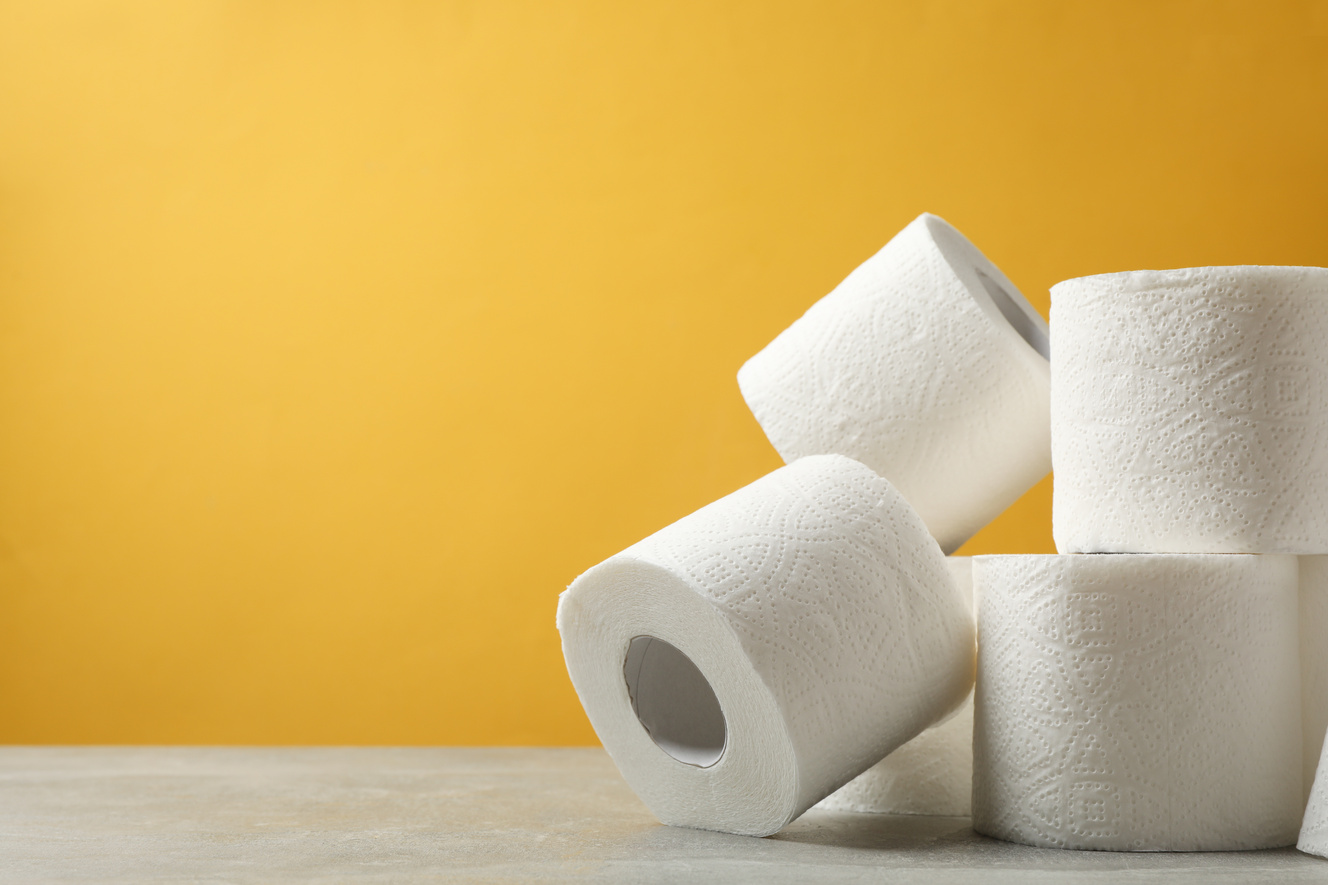 Toilet Paper against Yellow Background, Space for Text